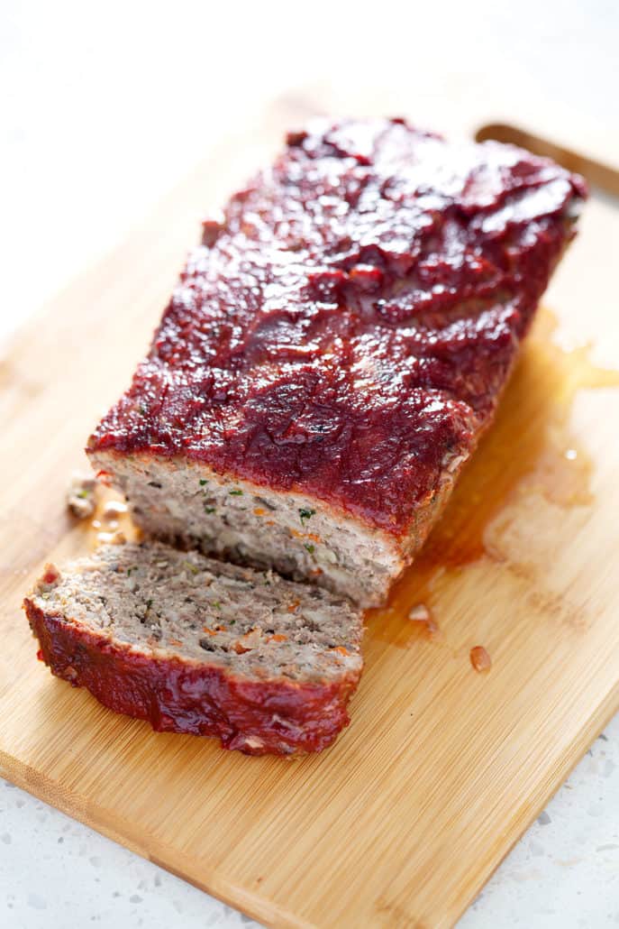 AIP meatloaf on cutting board with AIP ketchup