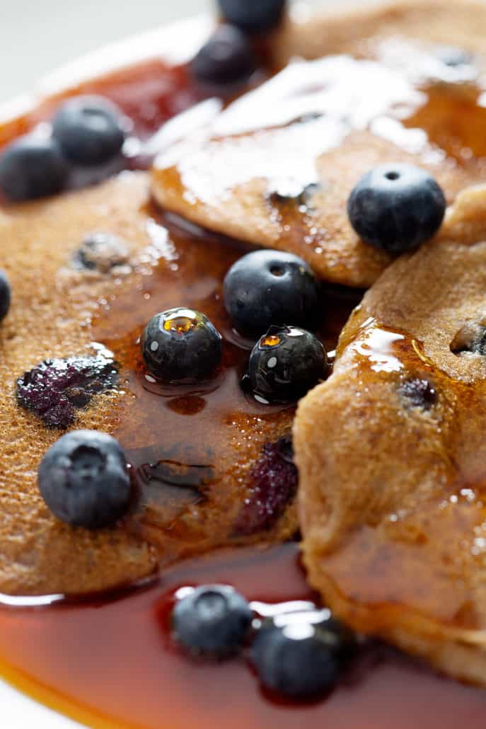 close up of AIP Blueberry Pancakes with maple syrup