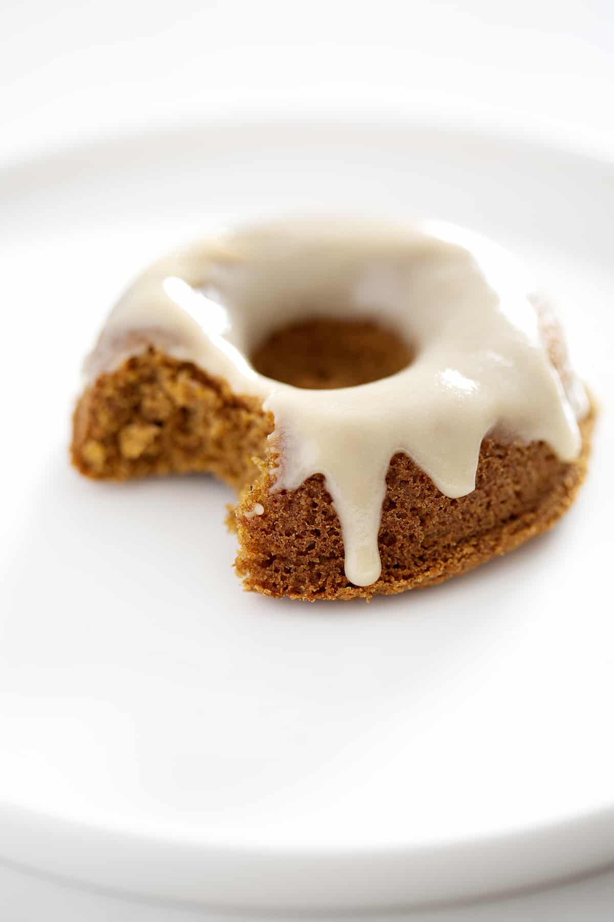 close up of paleo pumpkin donut with bite missing