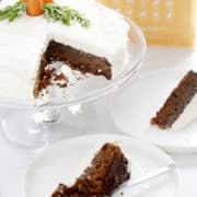 carrot cake on stand with slices on plates