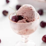 cup of AIP Black Cherry Ice Cream with cherry on top
