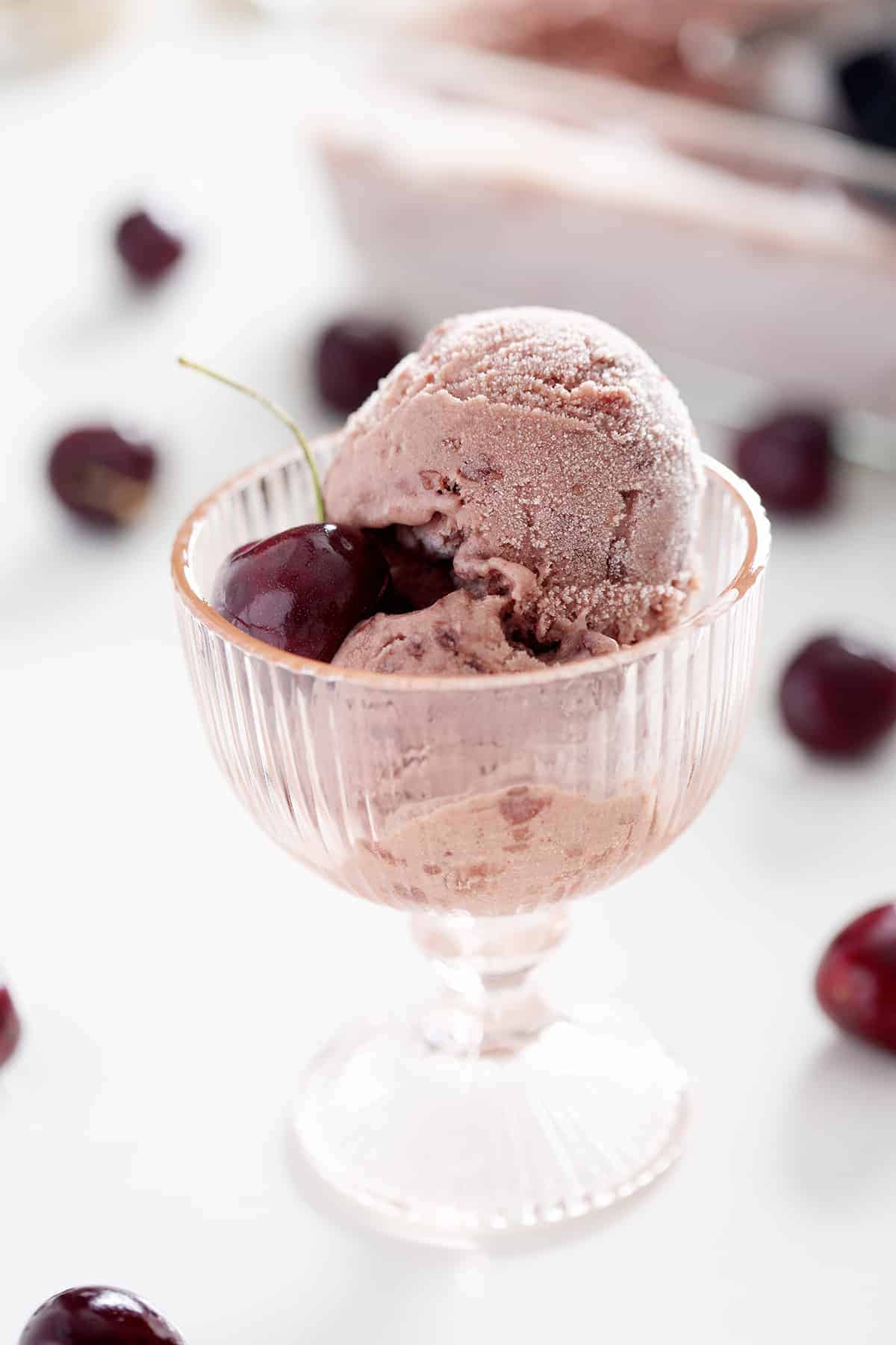 cup of AIP ice cream with cherry on top