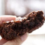 close up of dairy free chocolate brownies in hand