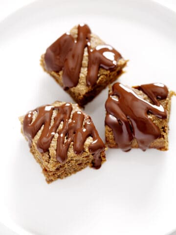 THREE NUT FREE PROTEIN BARS ON white plate