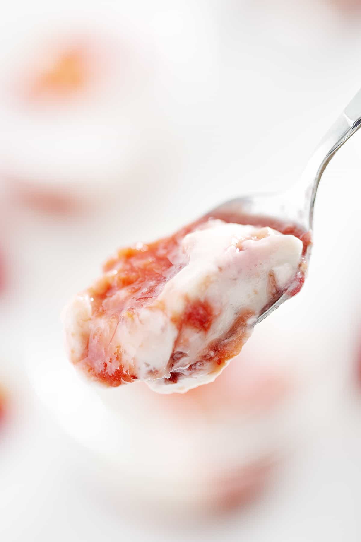 close up of spoonful of AIP Strawberry Rhubarb Panna Cotta with Coconut Milk