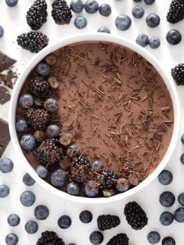 round dish of Chocolate Panna Cotta (Coconut Milk) with berries