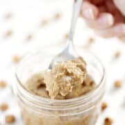 spoonful of tigernut butter with whole tigernuts in background