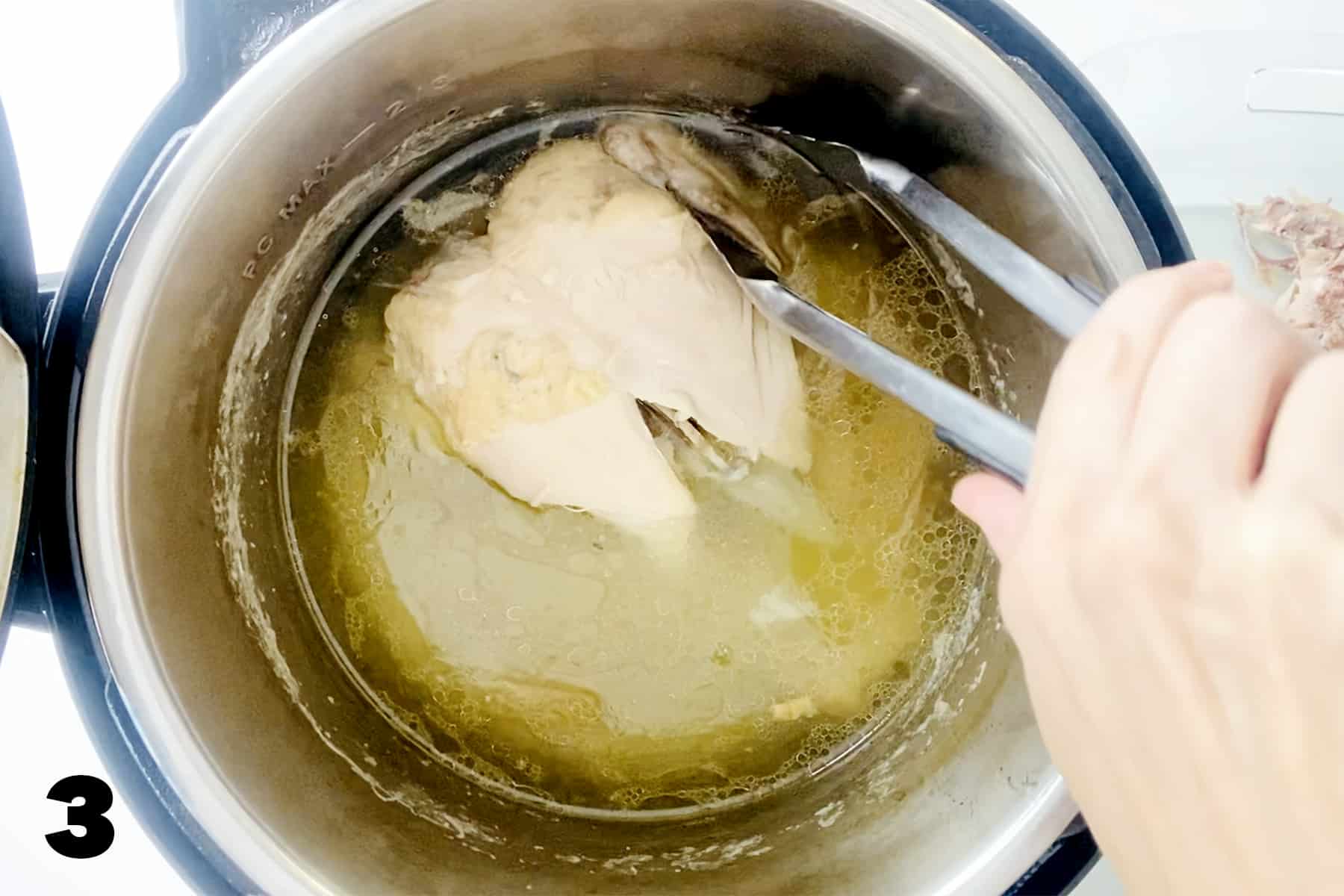 using tongs to remove whole chicken from instant pot