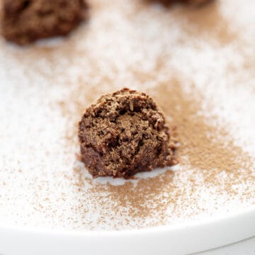 cocoa dusted truffle on white plate