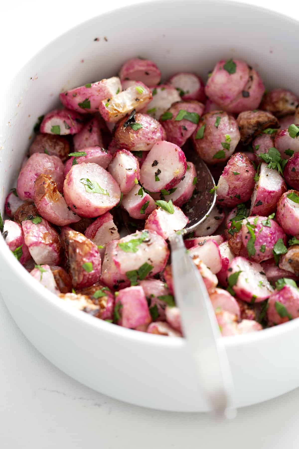 bowl of air fried radishes with spoon