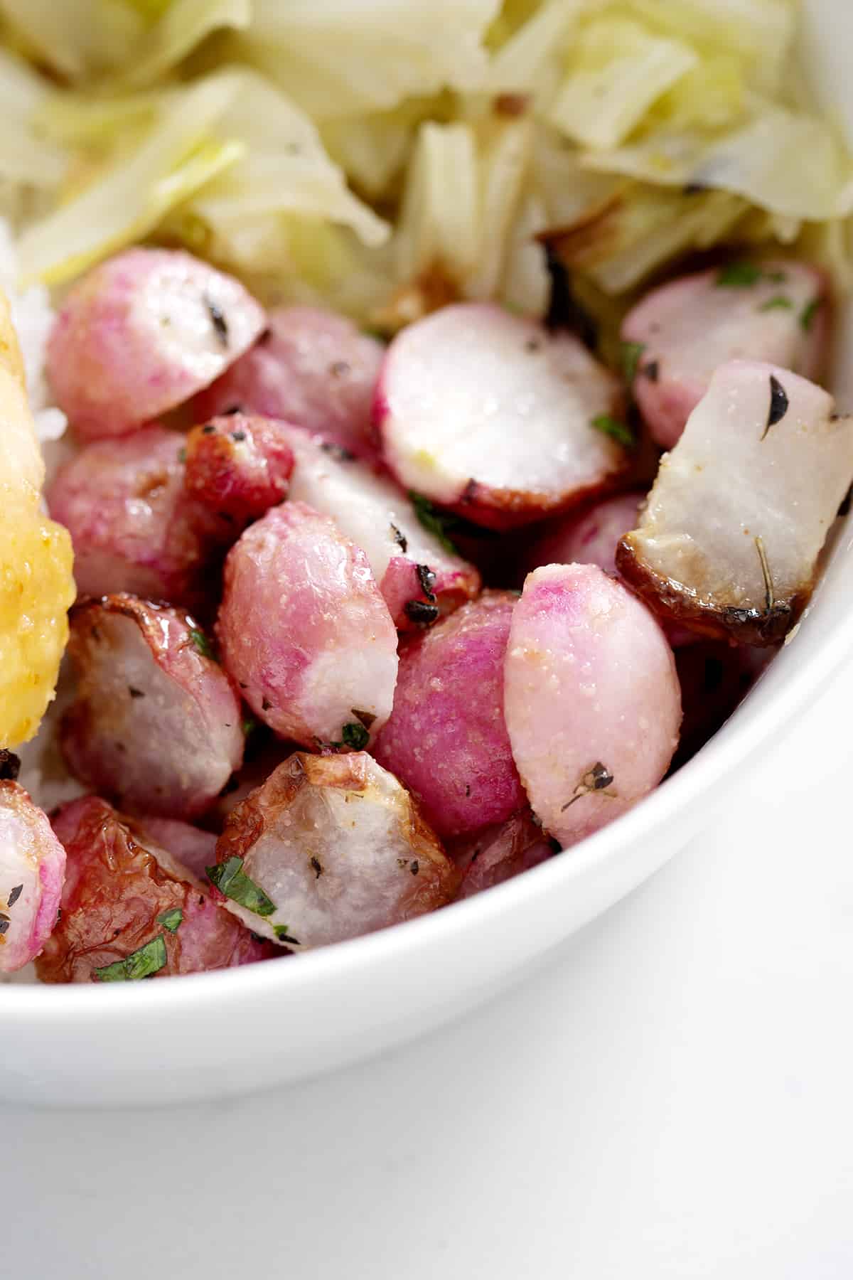 close up of bowl of Air Fryer Radishes