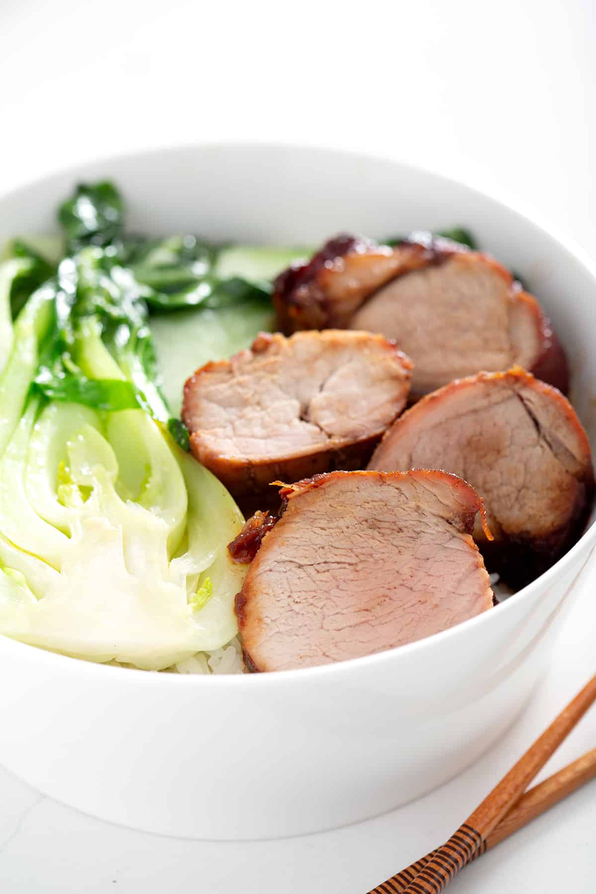 bowl of chinese bbq pork with bok choy