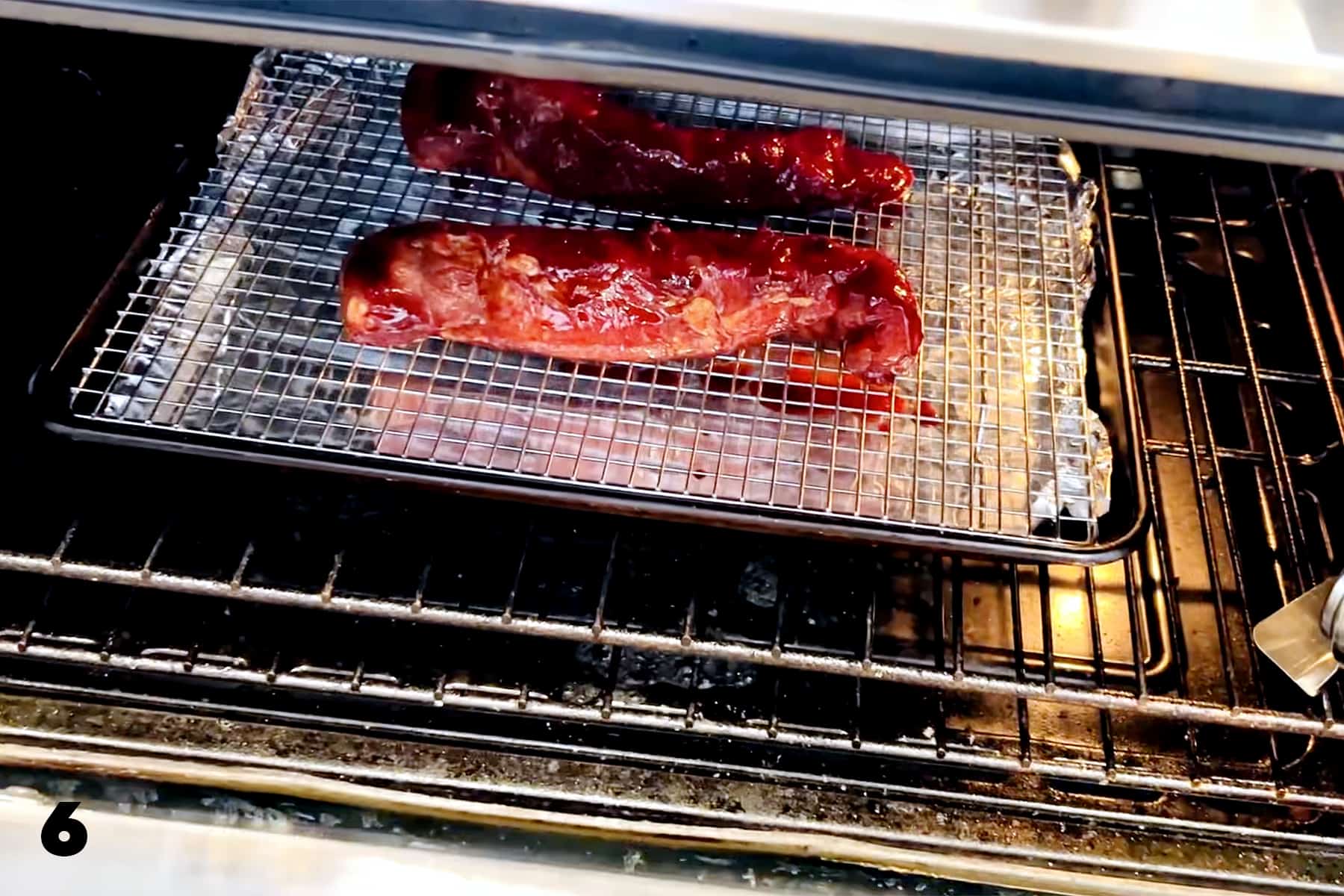 pork tenderloins on baking sheet in oven