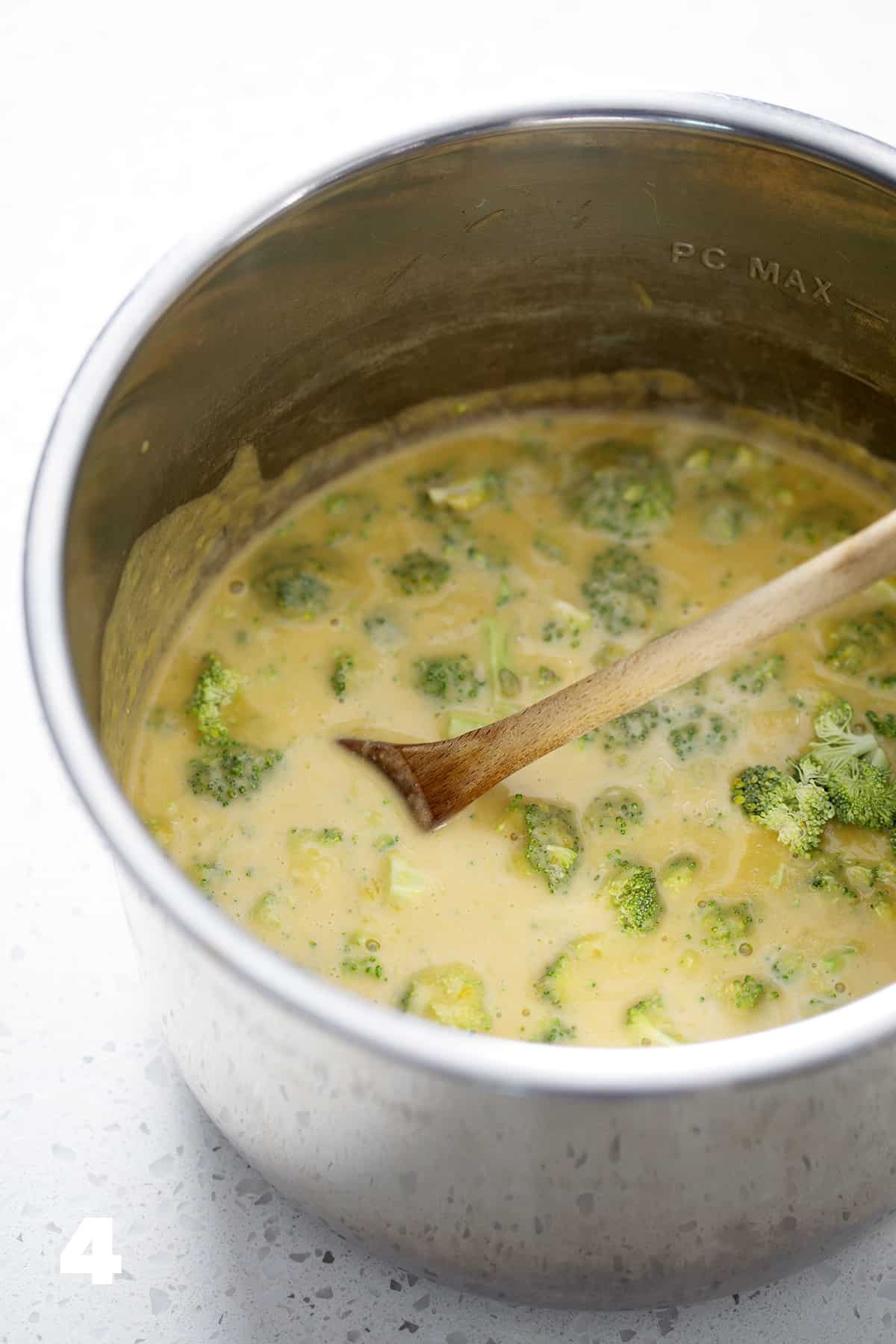 instant pot filled with broccoli cheese soup