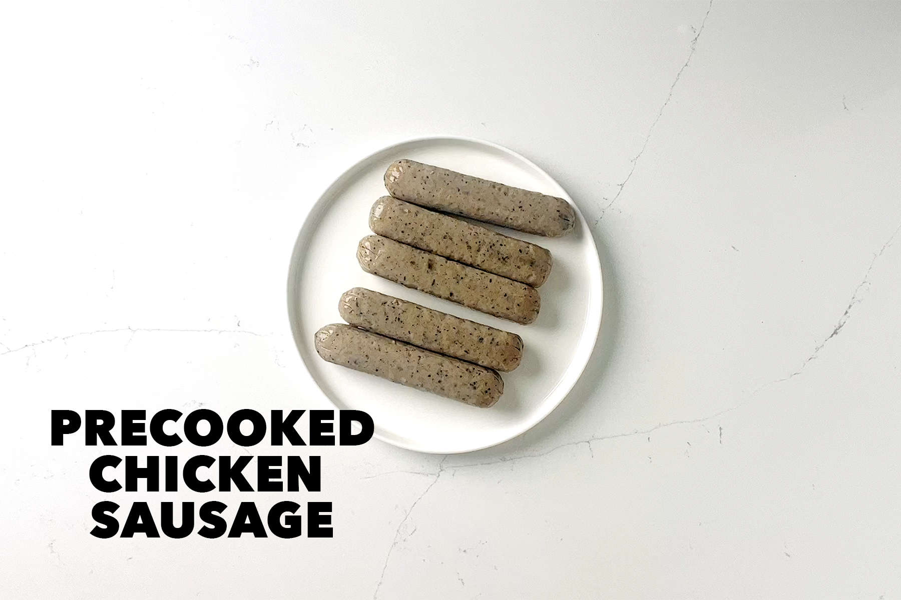 chicken sausage on plate on white background