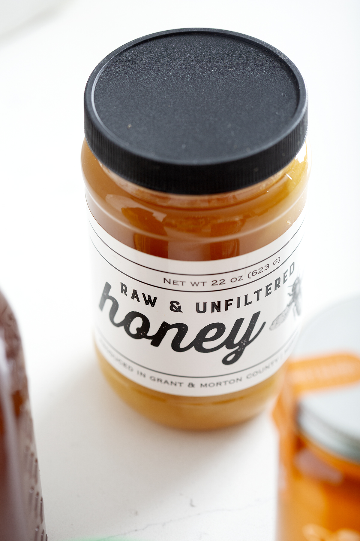 jar of gluten free honey with black lid