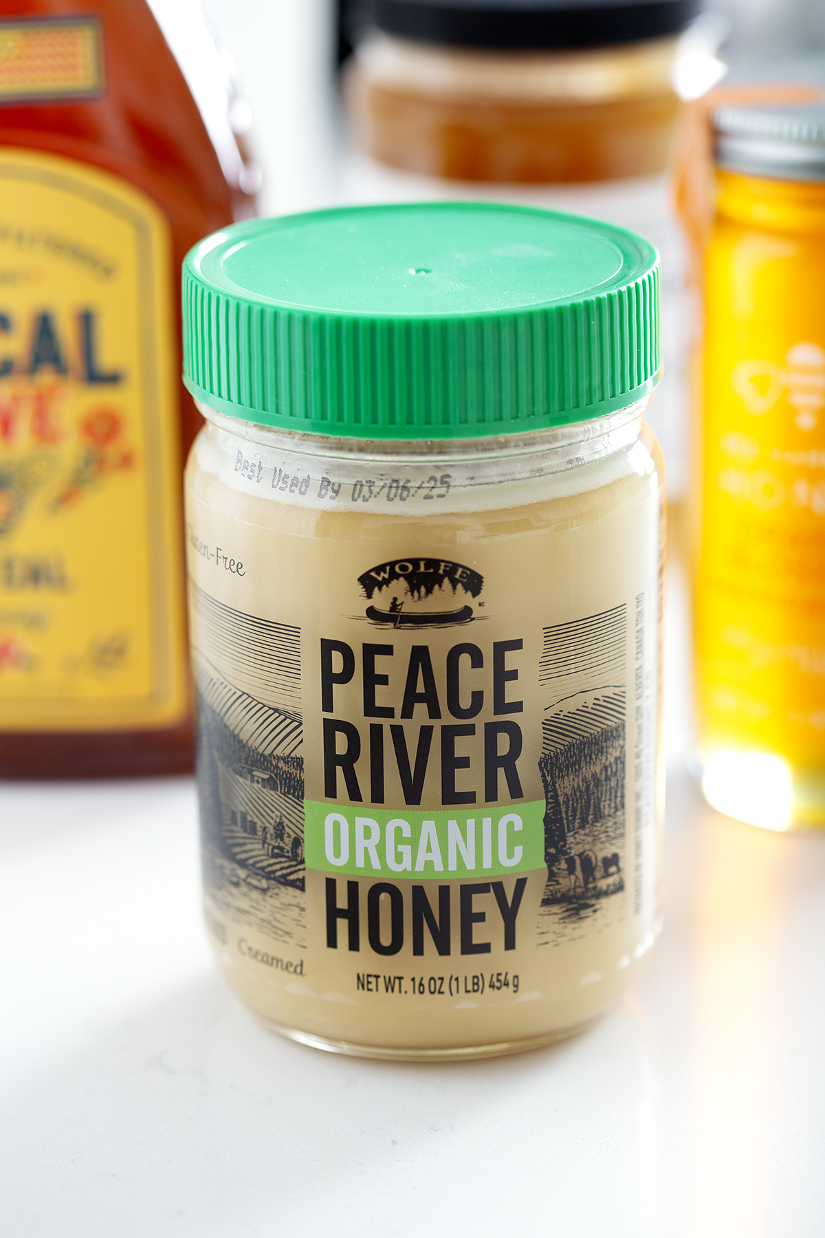 jar of peace river honey with green top