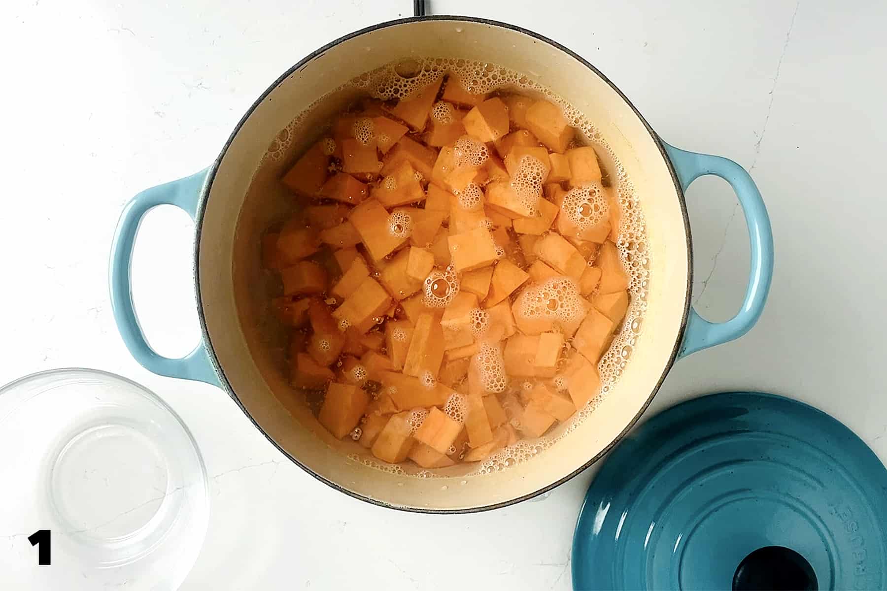 pot of boiling water with cubed sweet potatoes