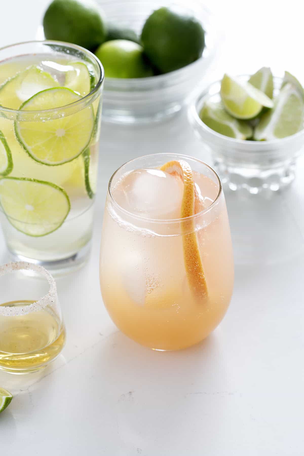 tequila drinks with lime and grapefruit garnishes
