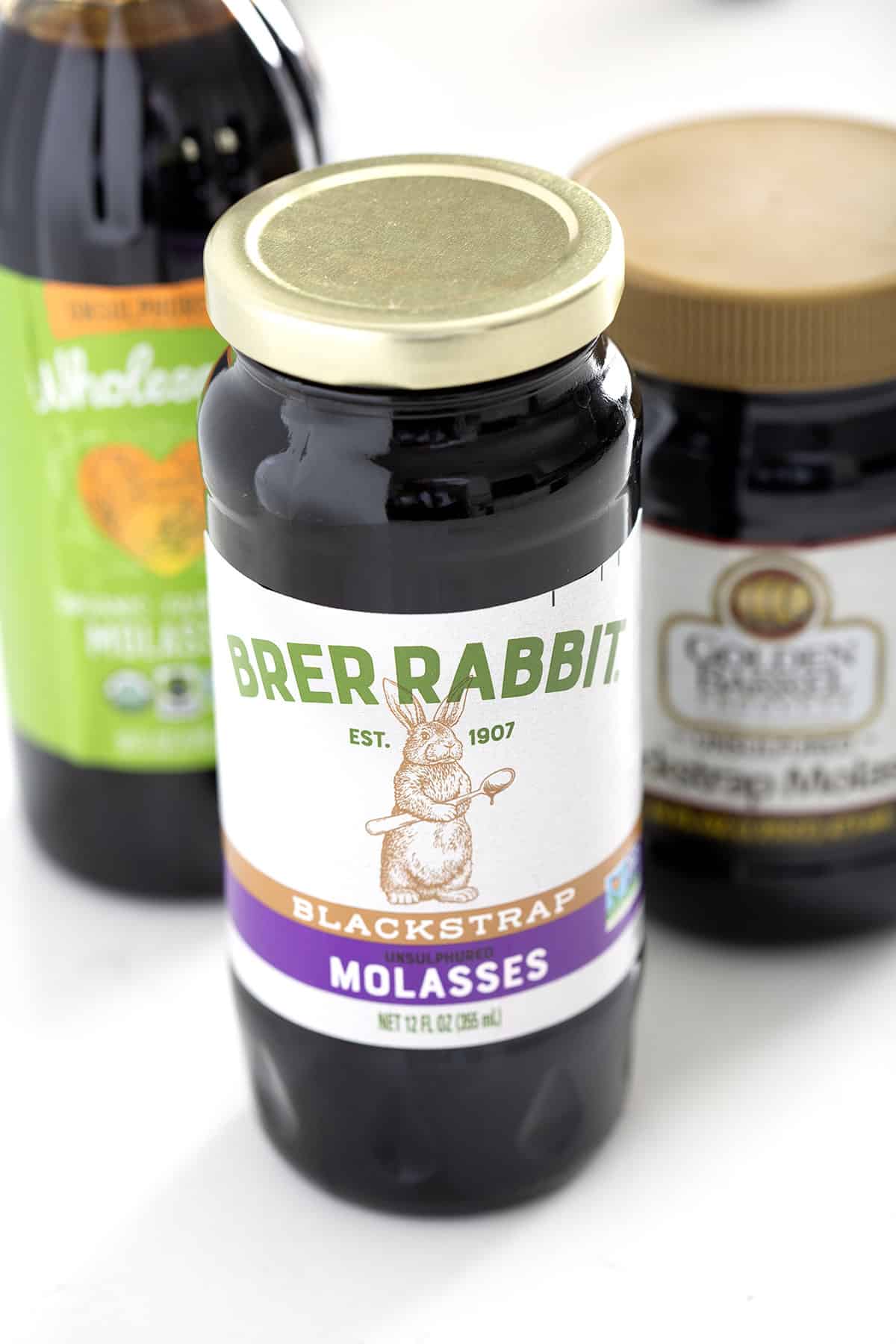 jar of brer rabbit blackstrap molasses on white background