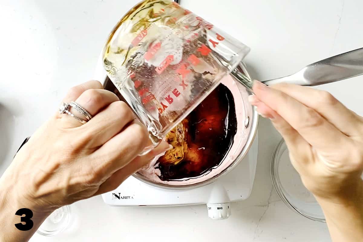 pouring honey into saucepan