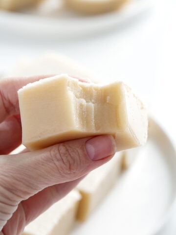hand holding piece of Chinese coconut pudding