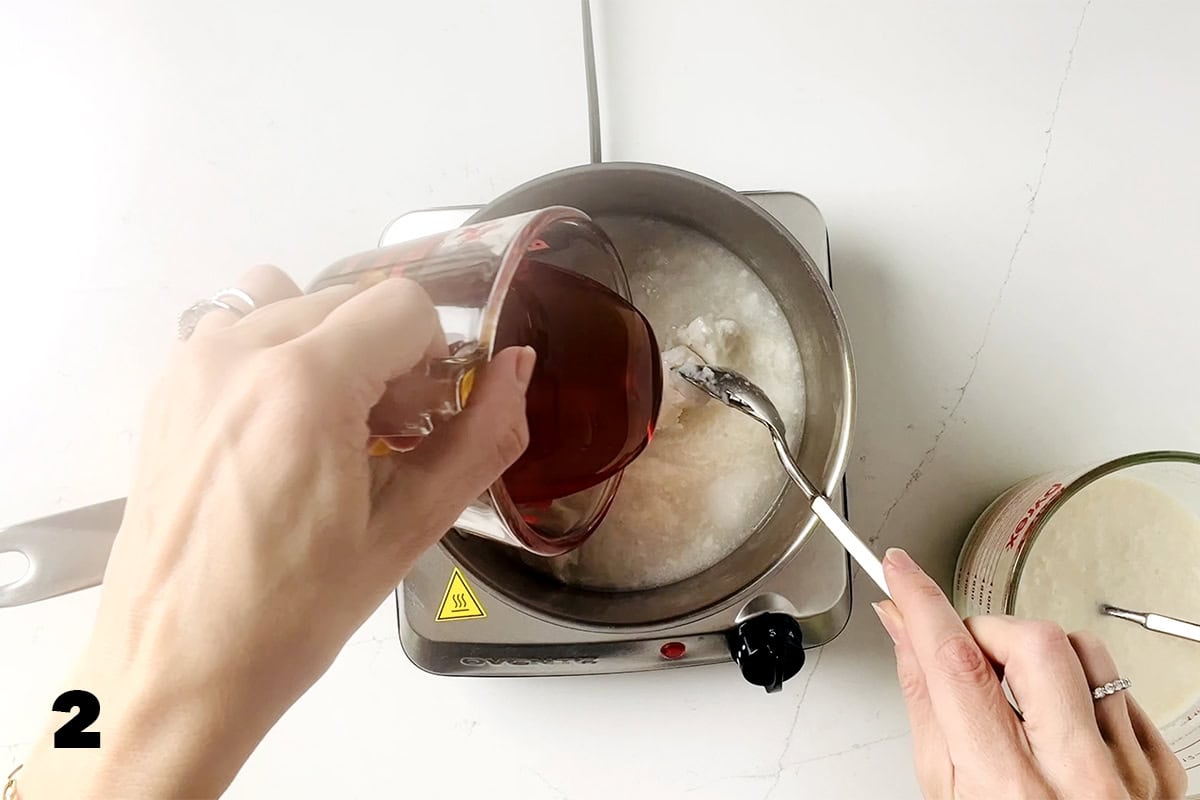 pouring honey into saucepan